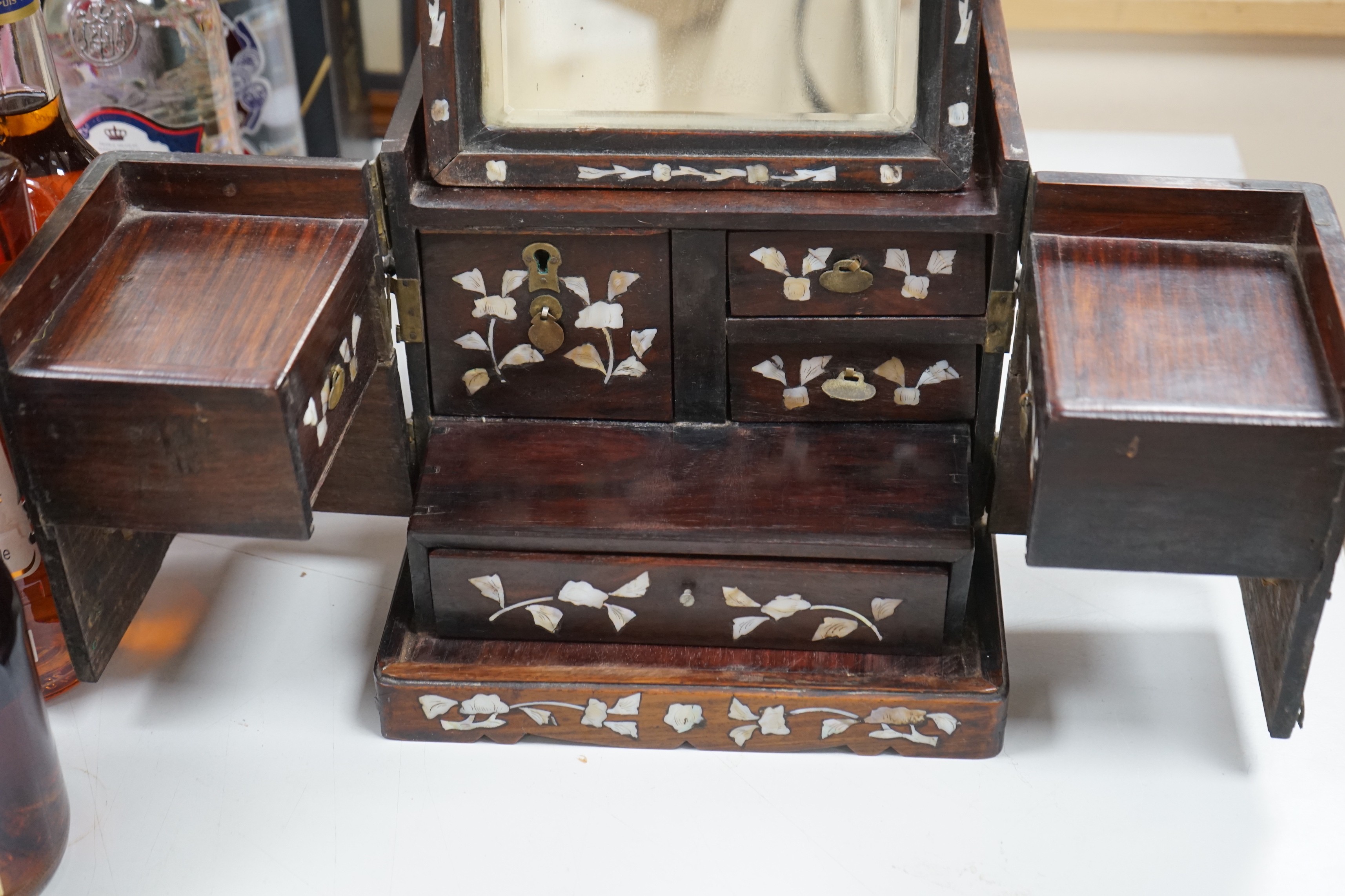 A Chinese mother of pearl inlaid hongmu jewellery box, c.1900, 30cm long